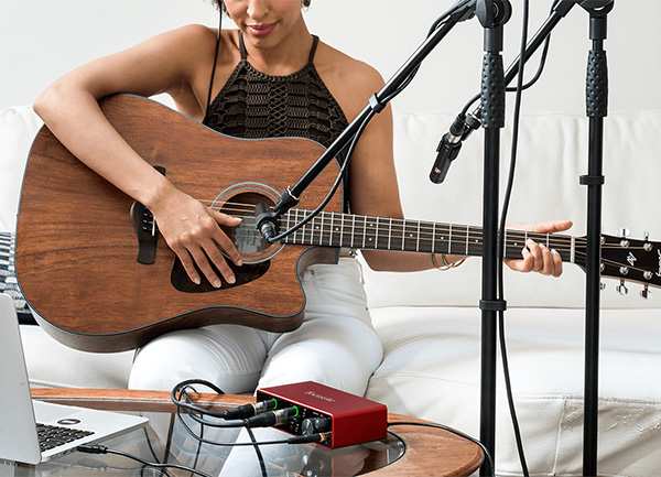 Girl Playing Acoustic Guitar with Scarlett Interface