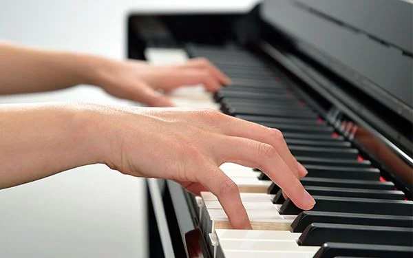 Hands Playing Yamaha CLP Keybed Close Detail
