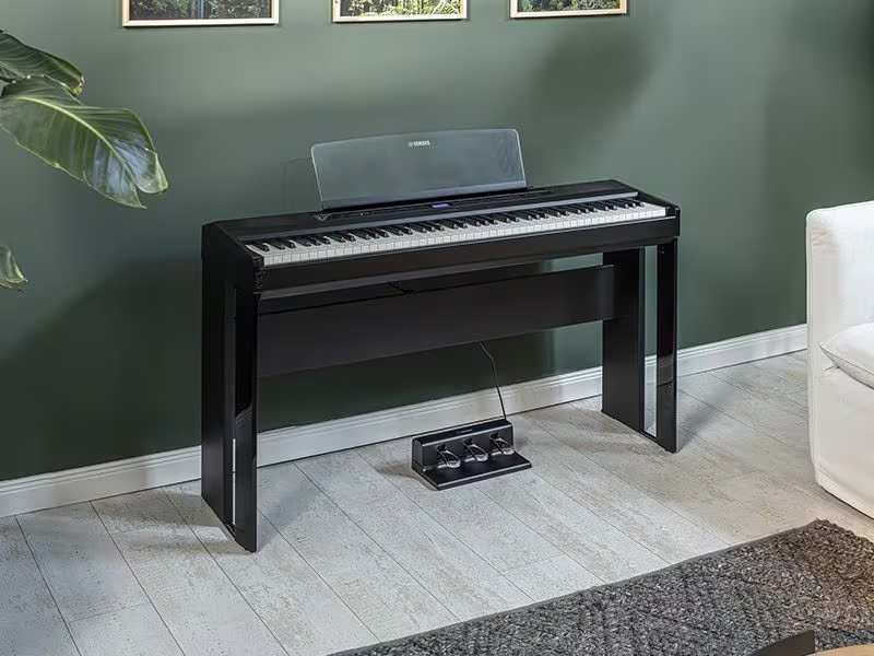 P525 Digital Piano shown with optional stand and pedal accessories